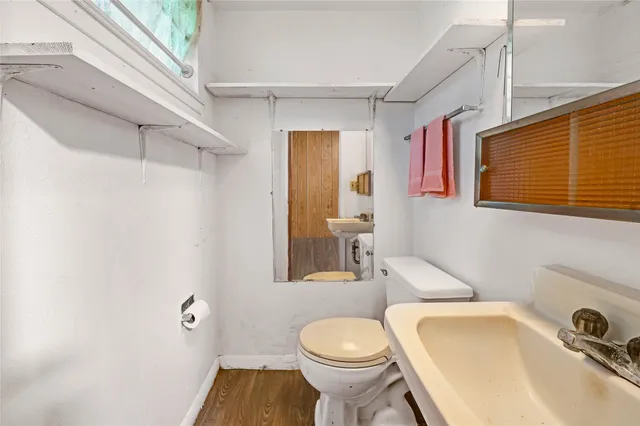 a bathroom with a sink and toilet