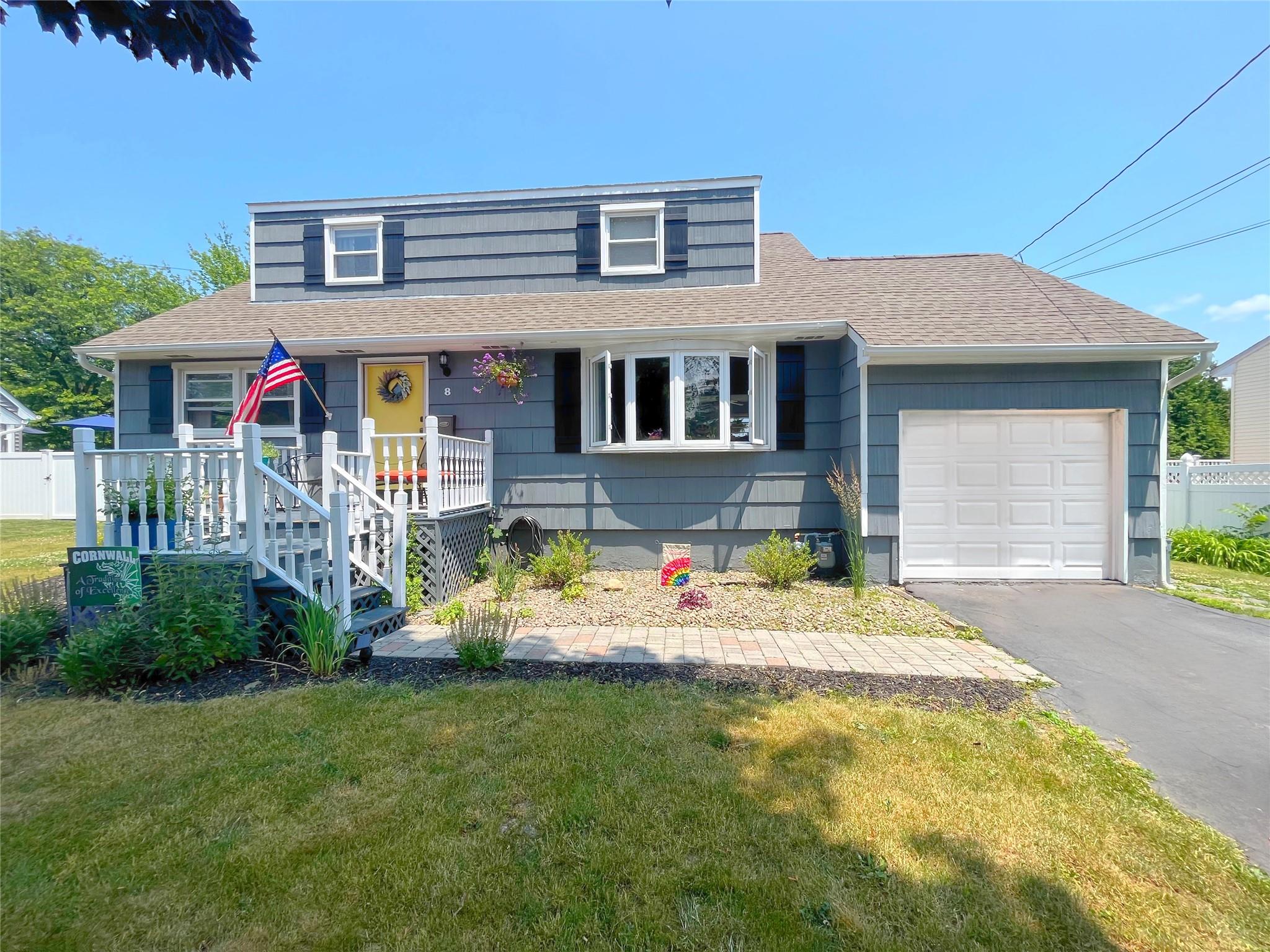 8 Curie Road Cornwall-on-Hudson, NY 12520 - Photo 1 of 1 View of front of home featuring a front lawn, a porch, and a garage