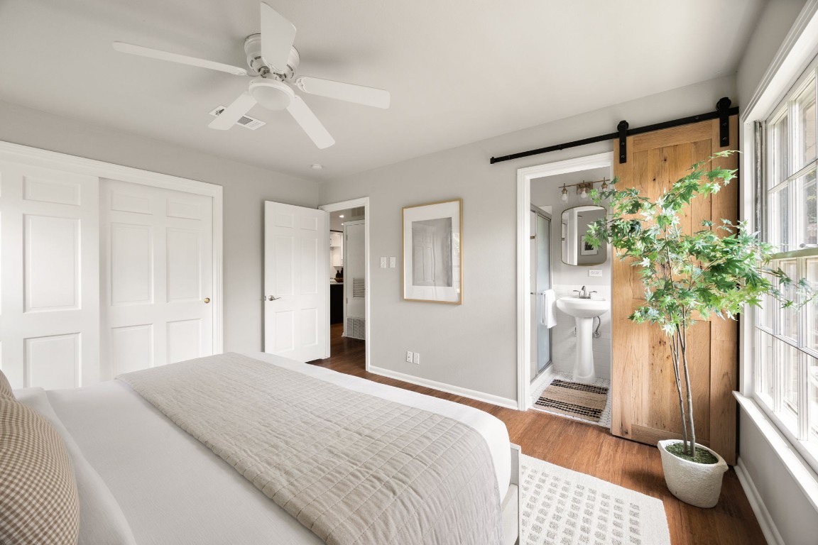 1601 Northridge Drive Austin, TX 78723 - Photo 27 of 40 a bedroom with a bed and a potted plant