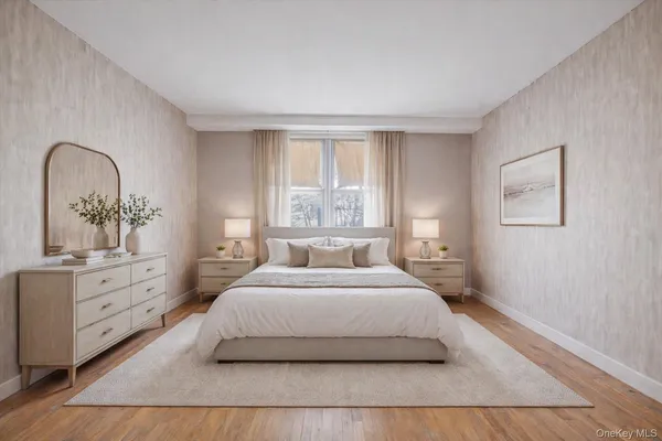a bedroom with a large bed and a dresser