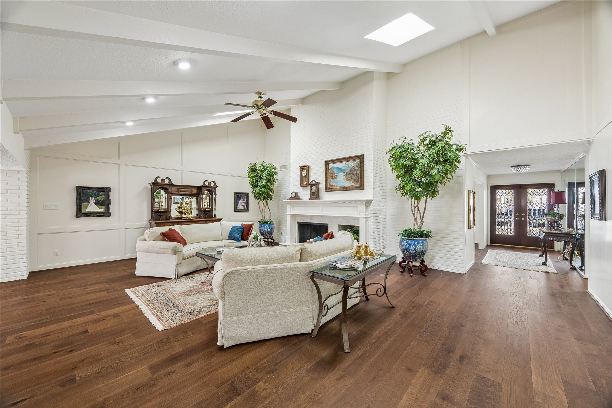 13503 Myrtlea Drive Houston, TX 77079 - Photo 13 of 50 a living room with furniture a fireplace and a wooden floor