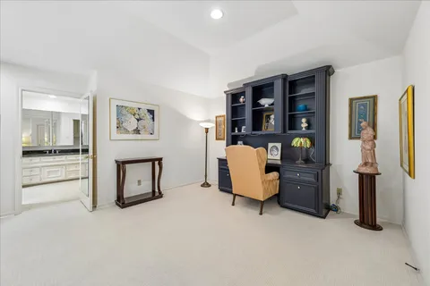 a large bathroom with a large tub and sink