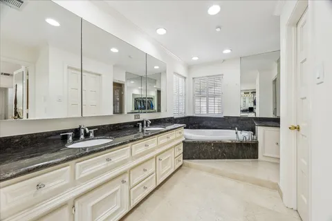 a bathroom with a bathtub and a sink