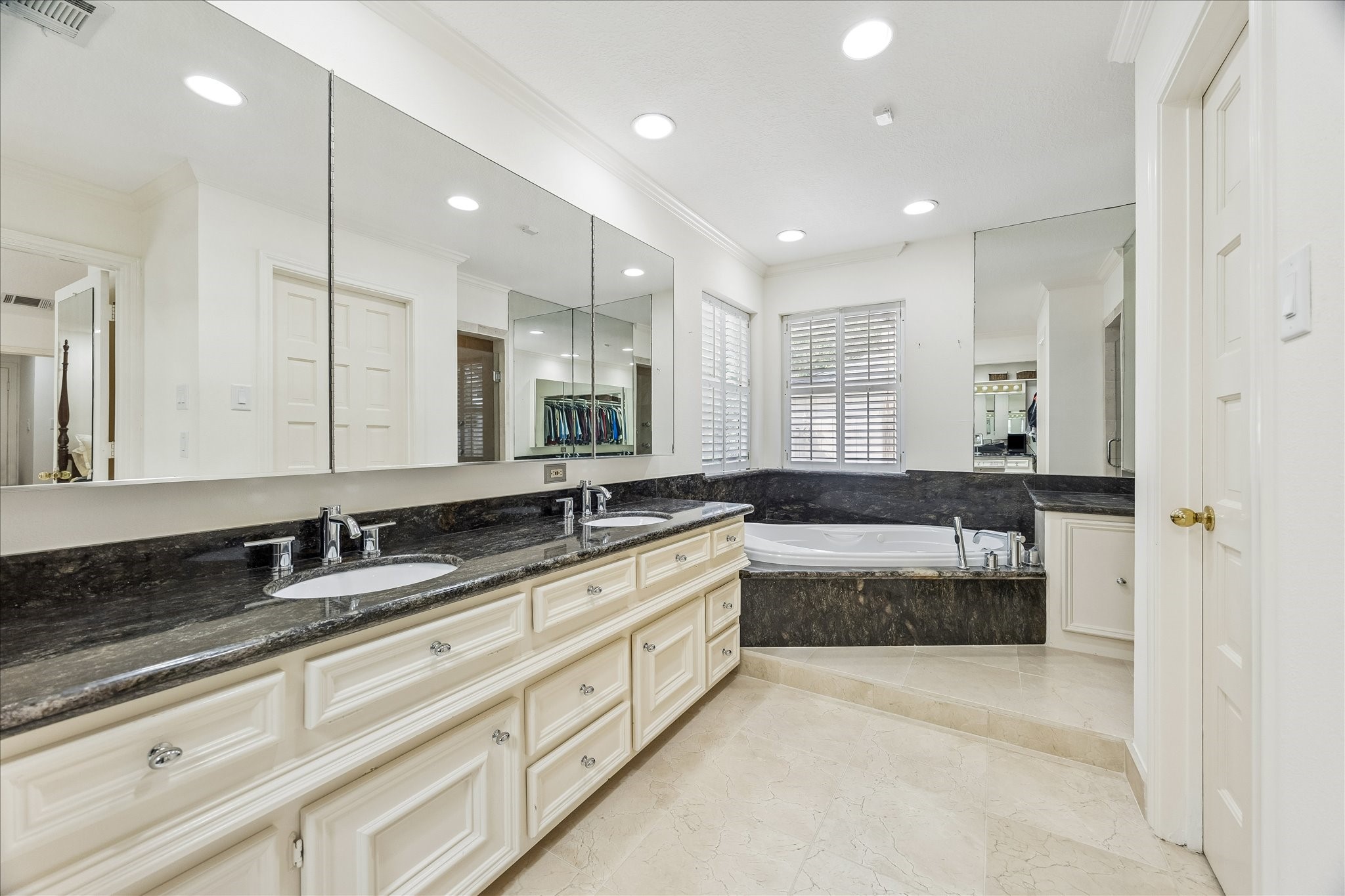 13503 Myrtlea Drive Houston, TX 77079 - Photo 31 of 50 a large bathroom with a large tub and sink