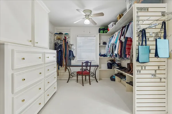a bathroom with a double vanity sink mirror and shower
