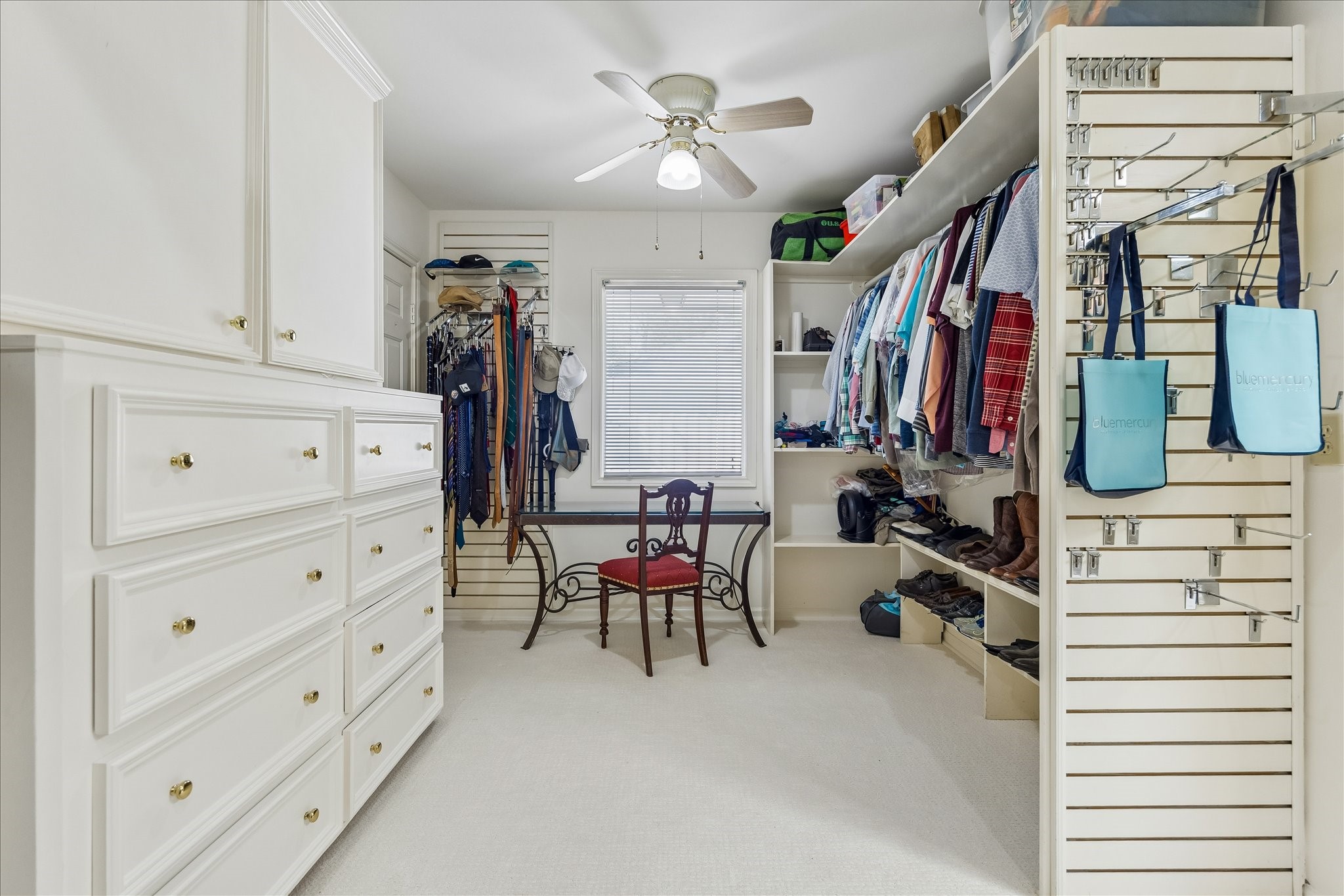 13503 Myrtlea Drive Houston, TX 77079 - Photo 34 of 50 a view of walk in closet with clothes and shoes