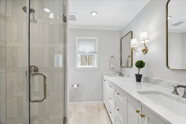 a bedroom with a bed a couch and dresser