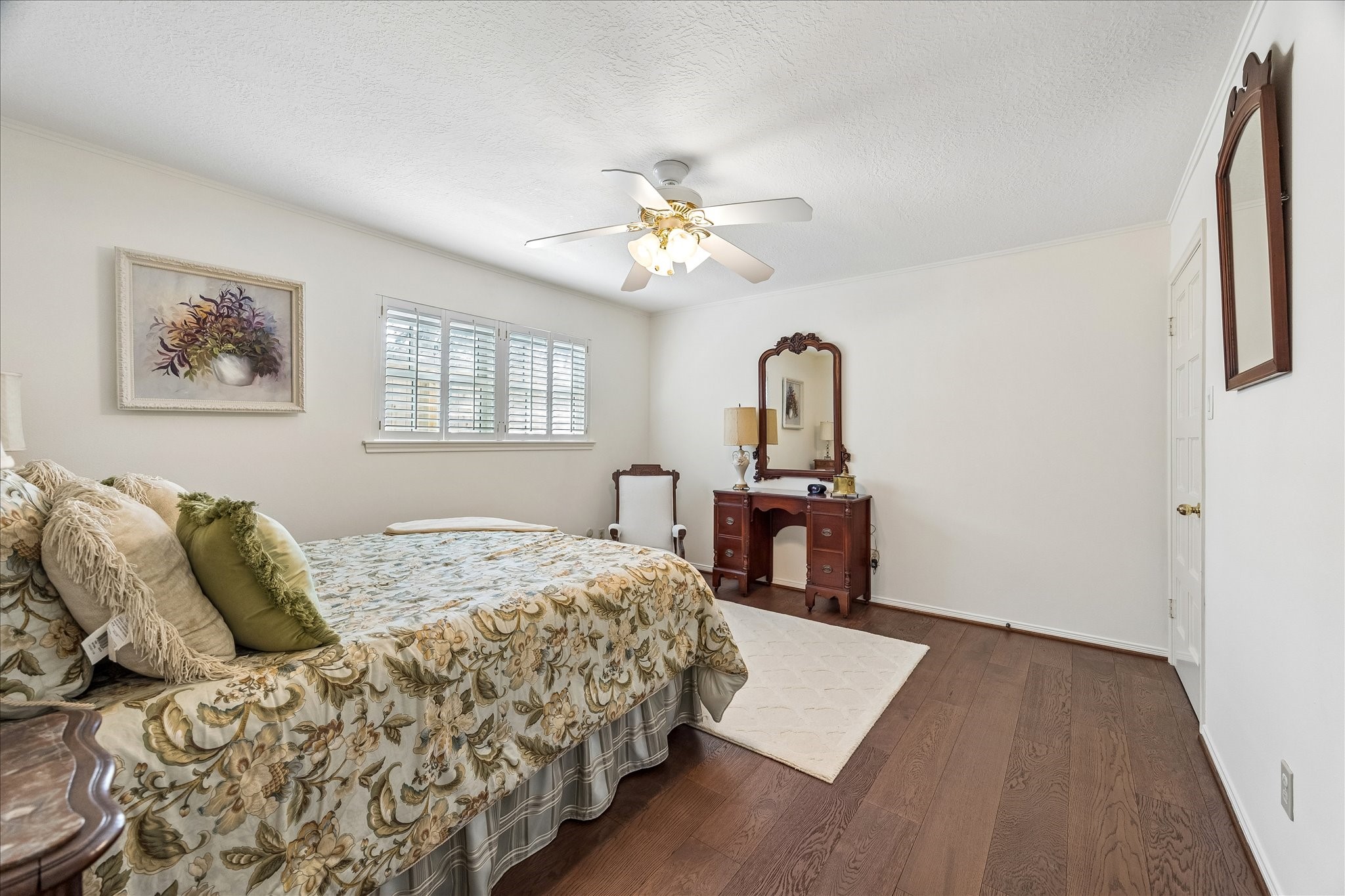 13503 Myrtlea Drive Houston, TX 77079 - Photo 38 of 50 a bedroom with a bed and a chandelier