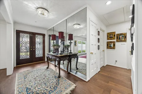 a view of a livingroom with furniture window and wooden floor