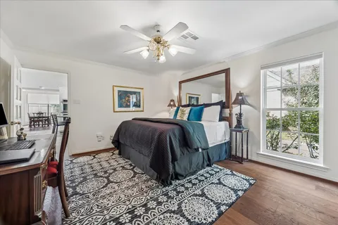a bedroom with a large bed and a window