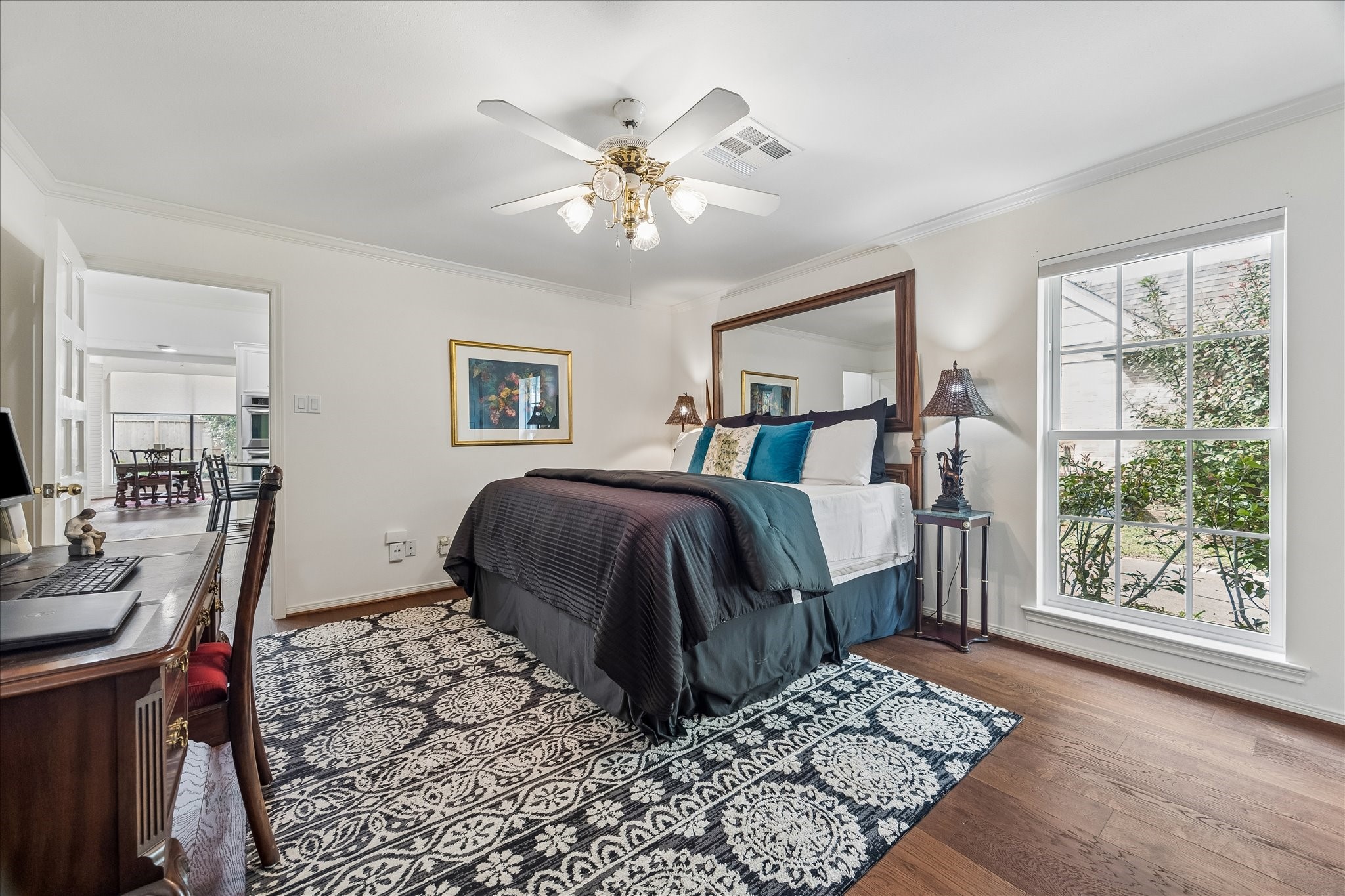 13503 Myrtlea Drive Houston, TX 77079 - Photo 40 of 50 a bedroom with a large bed and a window