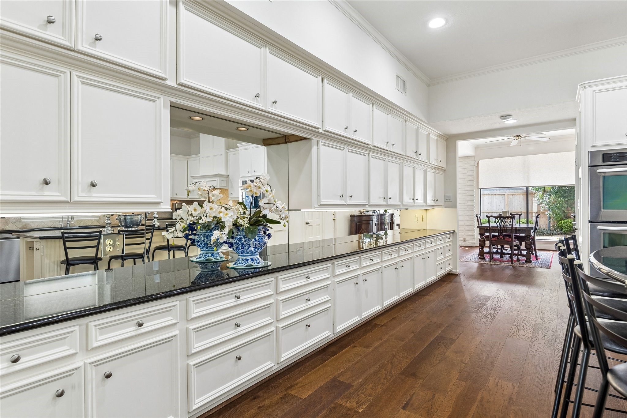 13503 Myrtlea Drive Houston, TX 77079 - Photo 10 of 50 a kitchen with counter top space and wooden floor