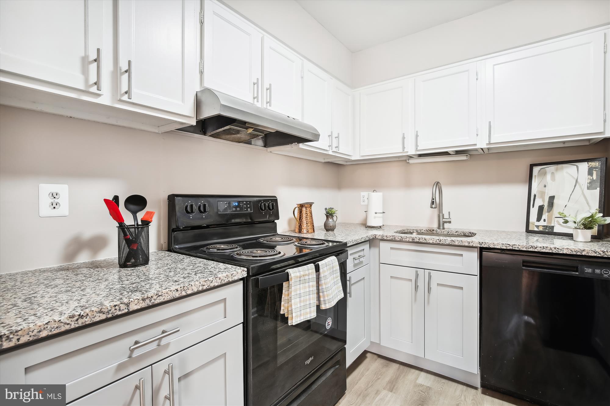 6143 Edsall Road, Unit H Alexandria, VA 22304 - Photo 8 of 18 a kitchen with stainless steel appliances granite countertop a sink stove and cabinets