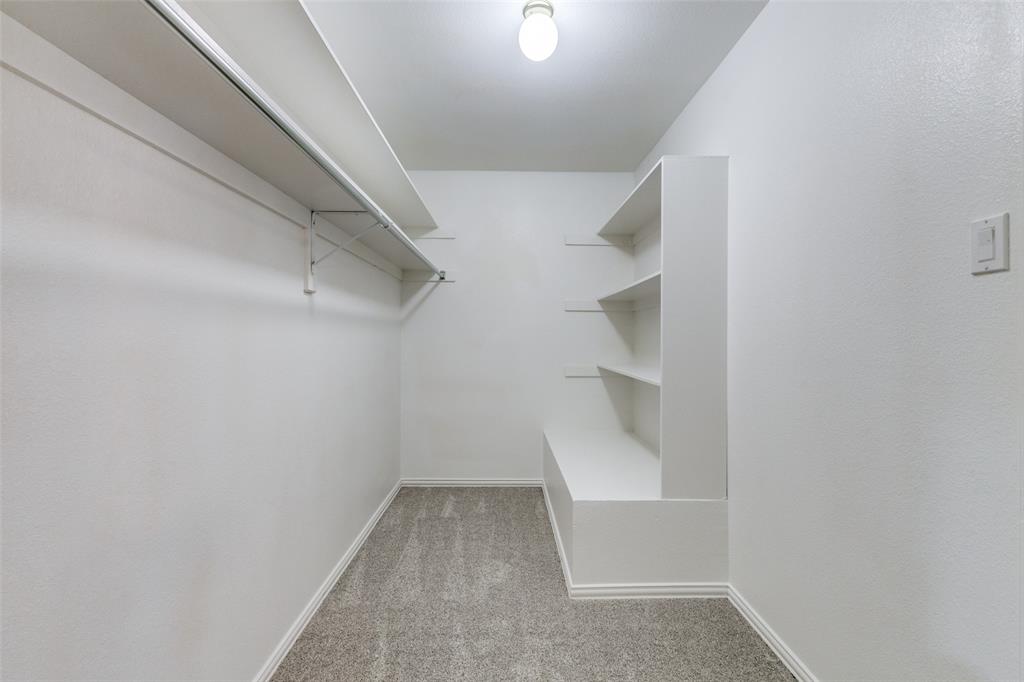 17101 Vista Tree Circle Dallas, TX 75248 - Photo 17 of 22 a view of an empty walk in closet