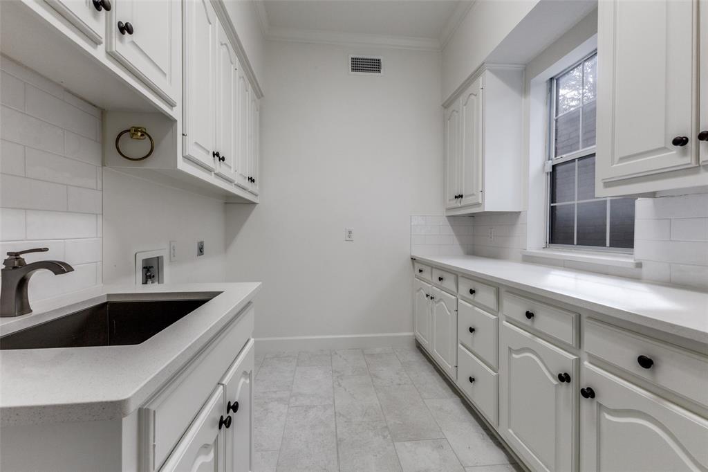 17101 Vista Tree Circle Dallas, TX 75248 - Photo 21 of 22 Huge Laundry room with natural light, sink and plenty of storage!