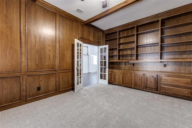 a view of an empty room with cabinet