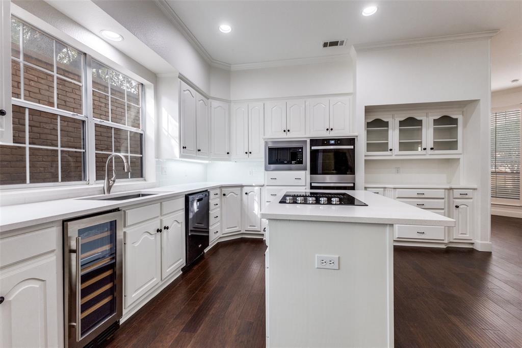 17101 Vista Tree Circle Dallas, TX 75248 - Photo 10 of 22 Updated appliances including downdraft cooktop, wine fridge and convection oven