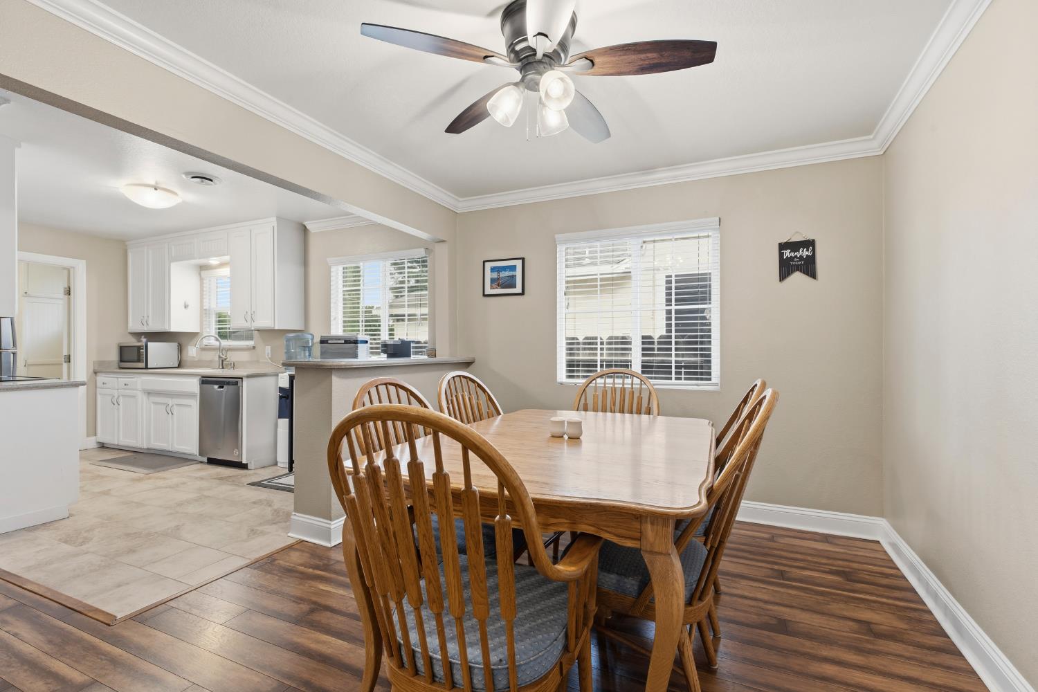 550 Bell Street Turlock, CA 95380 - Photo 10 of 36 a view of a dining room with furniture and a chandelier fan