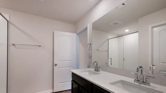 a bathroom with a sink and shower