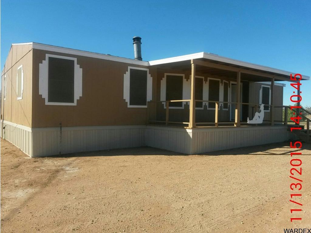 3925 Tonto Road Golden Valley, AZ 86413 - Photo 1 of 2 a front view of a house with a yard