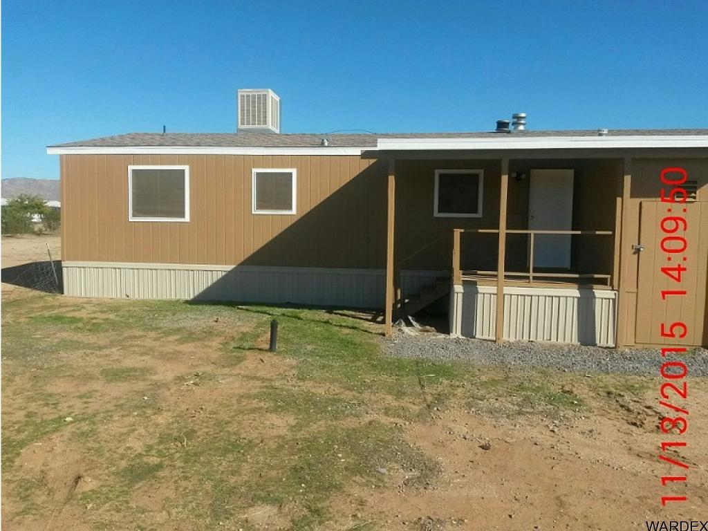 3925 Tonto Road Golden Valley, AZ 86413 - Photo 2 of 2 a front view of a house with a yard