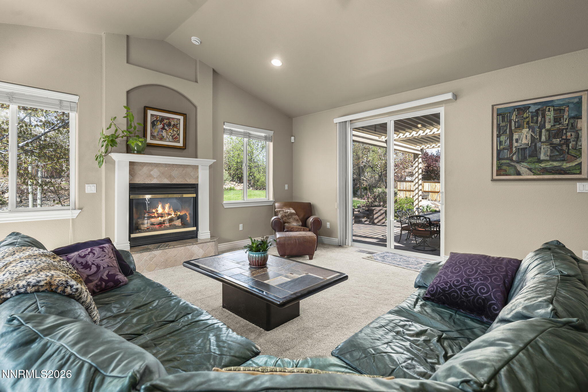 12635 Silver Wolf Road Reno, NV 89511 - Photo 27 of 48 a living room with furniture large window and fireplace