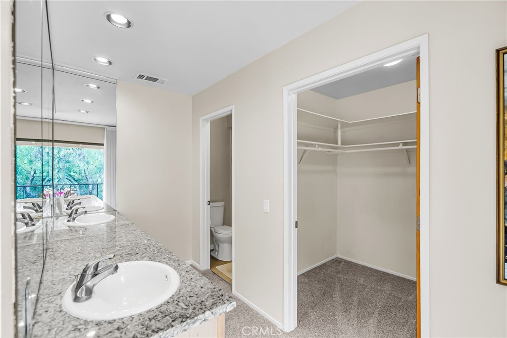 2252 El Capitan Drive Riverside, CA 92506 - Photo 31 of 51 a bathroom with a sink and a mirror