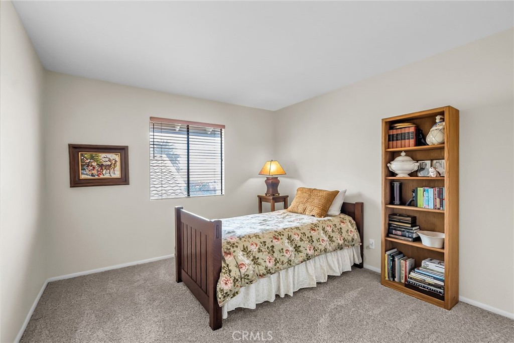 2252 El Capitan Drive Riverside, CA 92506 - Photo 36 of 51 a bedroom with a bed and a window