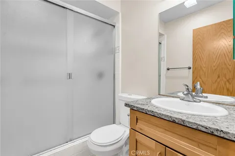 a view of a patio with table and chairs with wooden floor and fence