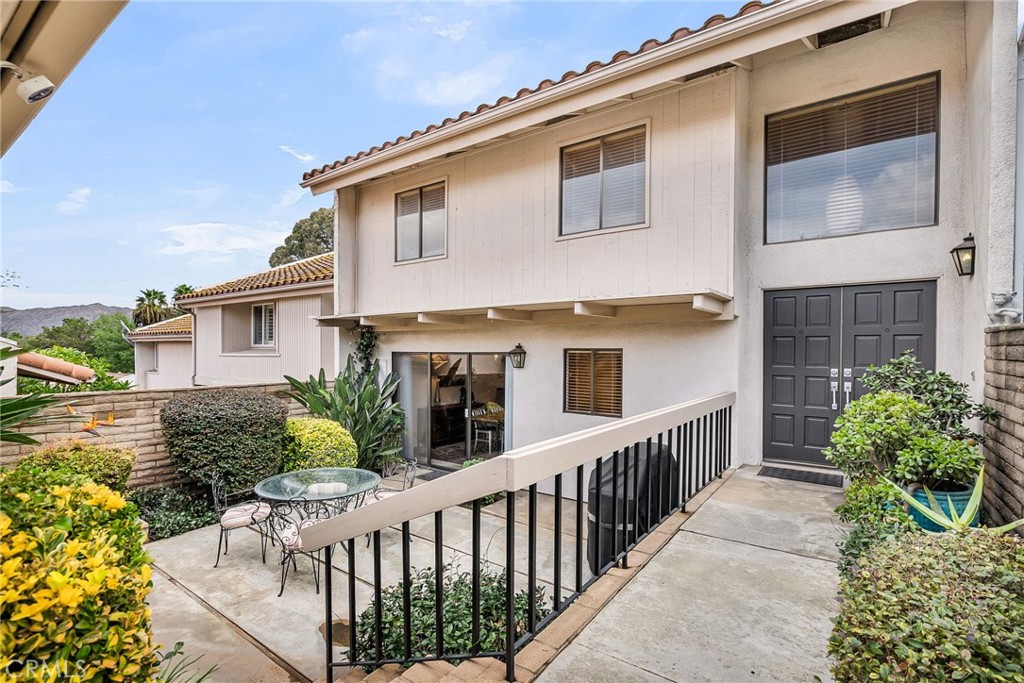 2252 El Capitan Drive Riverside, CA 92506 - Photo 9 of 51 a view of a house with brick walls and flower plants