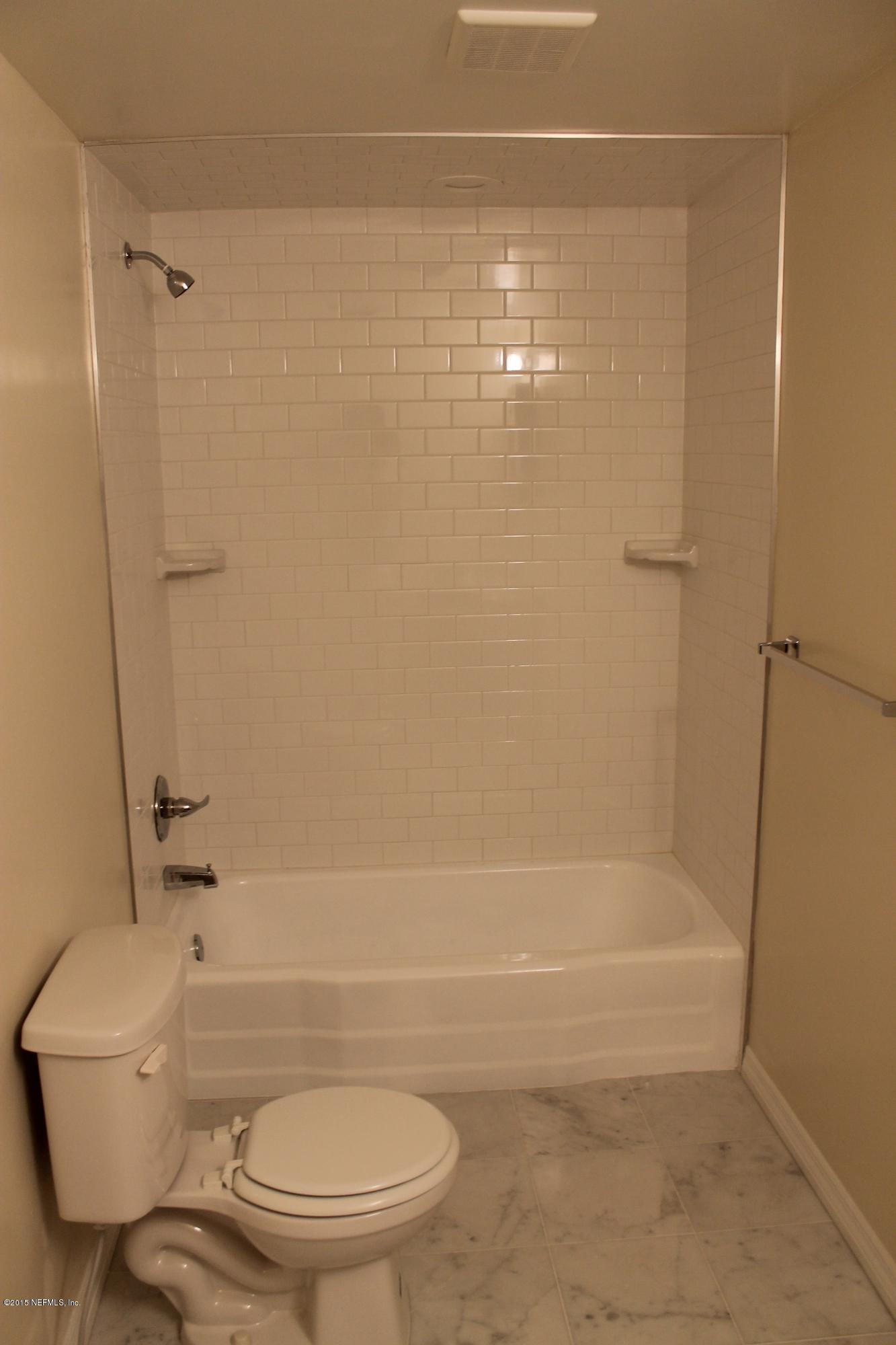 6207 Lone Star Road Jacksonville, FL 32211 - Photo 14 of 35 a bathroom with a toilet and a shower