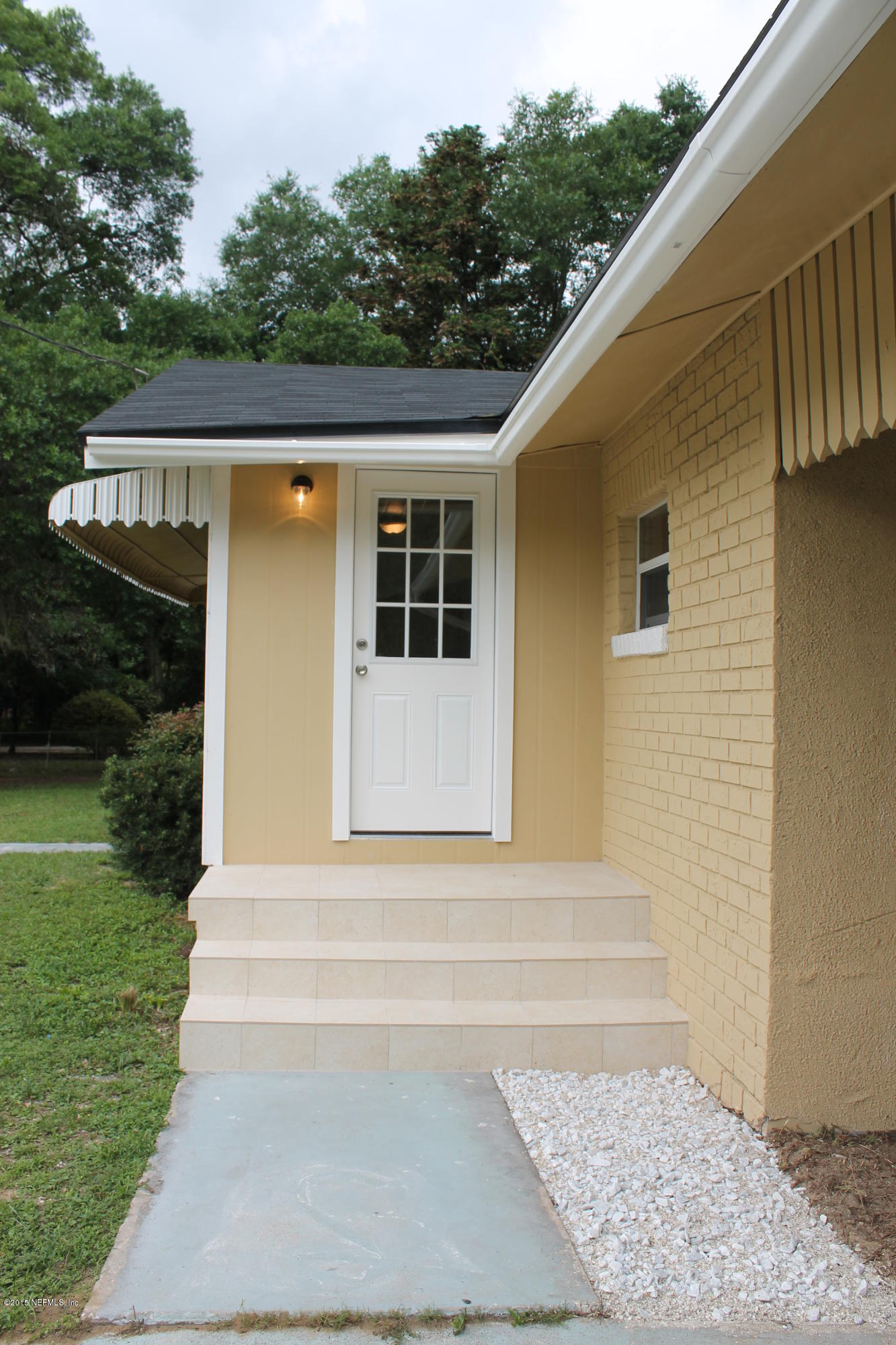 6207 Lone Star Road Jacksonville, FL 32211 - Photo 2 of 35 a front view of a house with a yard