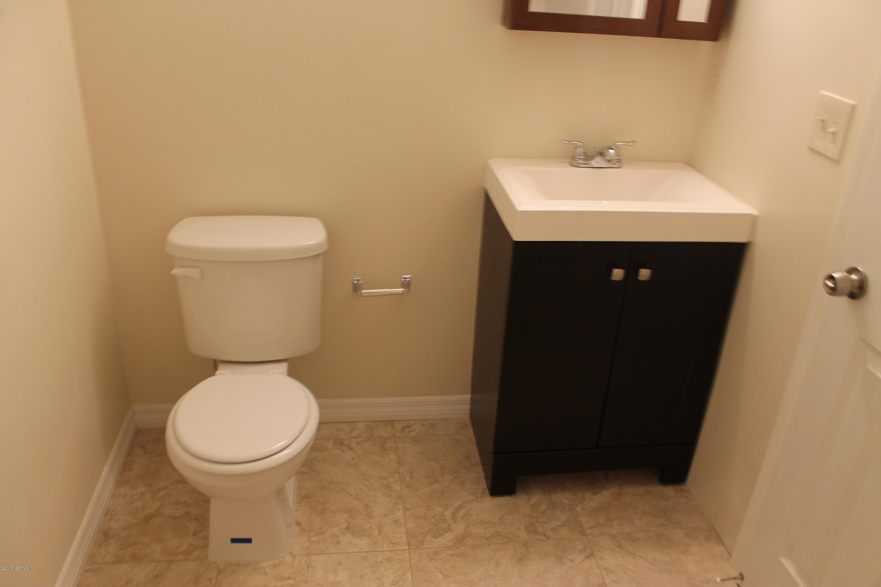 6207 Lone Star Road Jacksonville, FL 32211 - Photo 28 of 35 a bathroom with a sink and a toilet