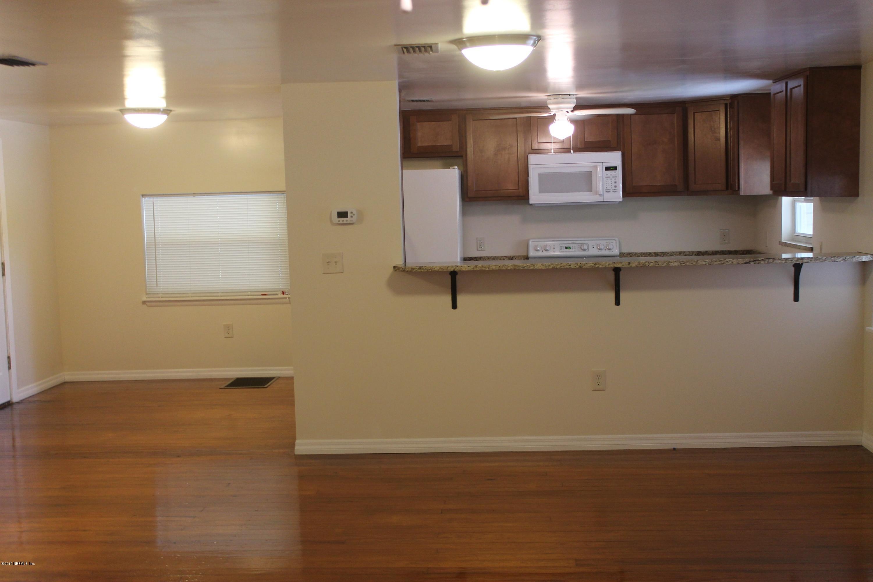 6207 Lone Star Road Jacksonville, FL 32211 - Photo 7 of 35 a view of a room with wooden floor and cabinet
