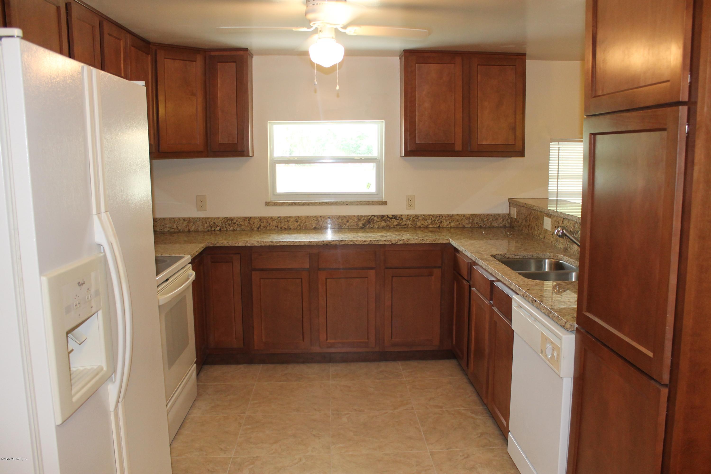 6207 Lone Star Road Jacksonville, FL 32211 - Photo 8 of 35 a kitchen with stainless steel appliances granite countertop a refrigerator and a sink