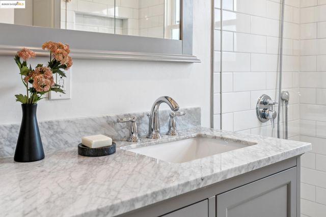 a kitchen with a refrigerator and a sink