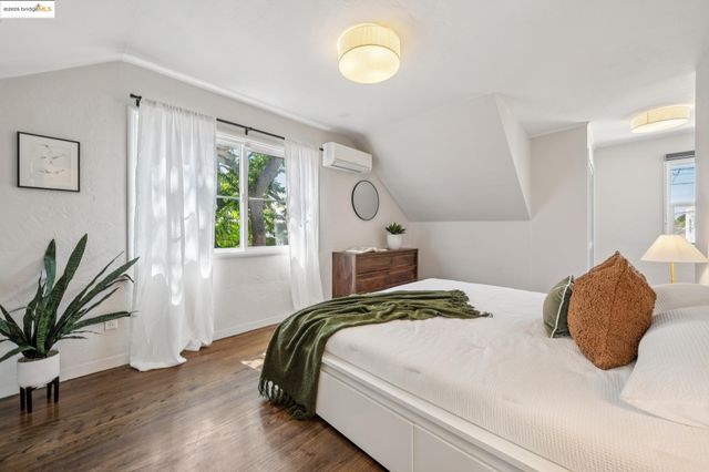 a bathroom with a granite countertop sink a mirror and shower