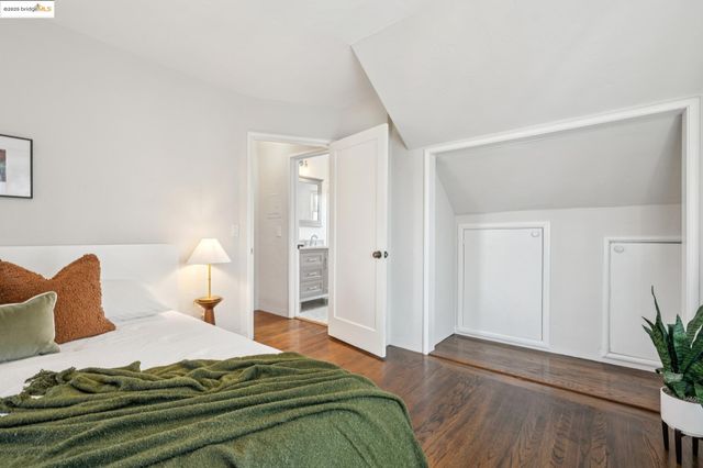 a bed room with a bed and a chair