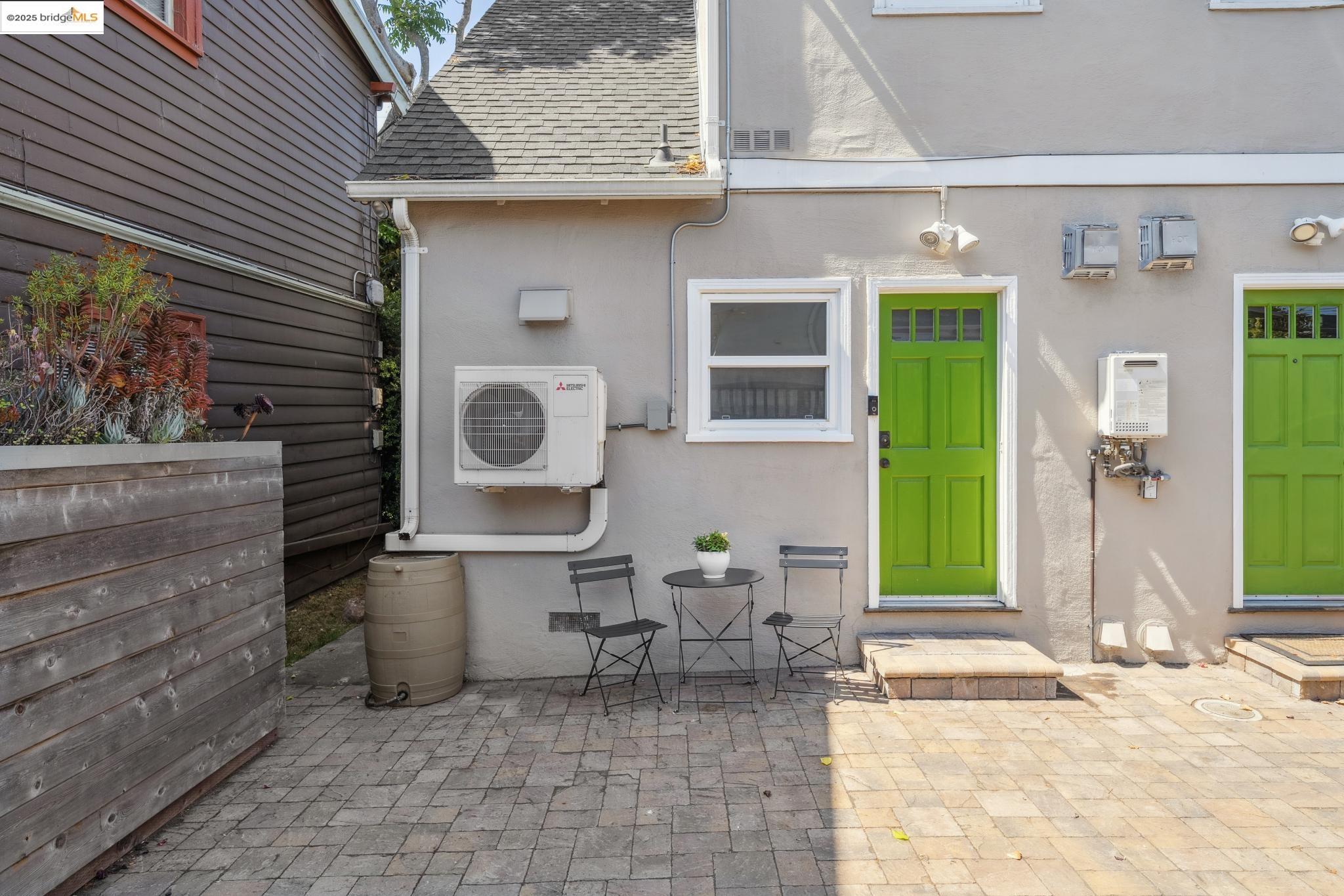 4170 Emerald Street, Unit 4 Oakland, CA 94609 - Photo 35 of 37 Property entrance featuring a patio area, stucco siding, and roof with shingles