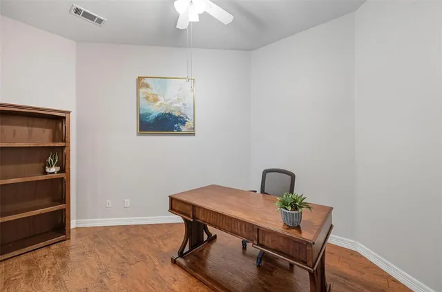 a view of a workspace with furniture