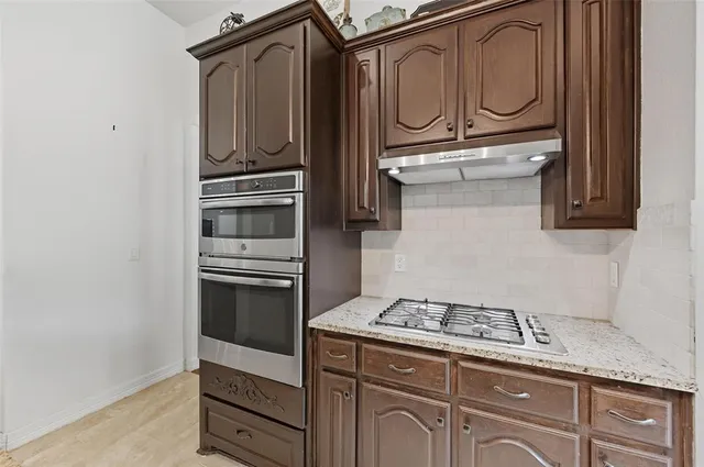 a kitchen with a sink and a window