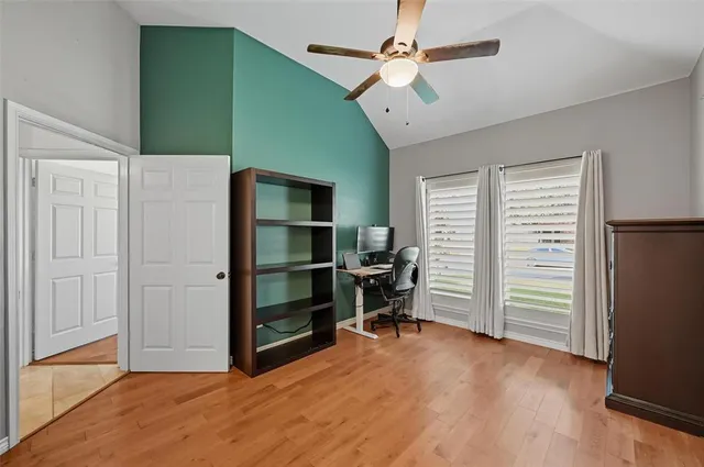a view of room with furniture and wooden floor