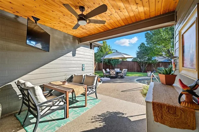a view of a patio with swimming pool