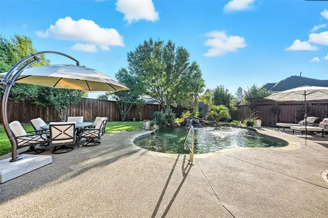 a view of a swimming pool with a patio