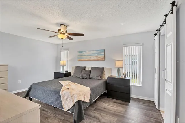 a living room with a bed furniture and a window