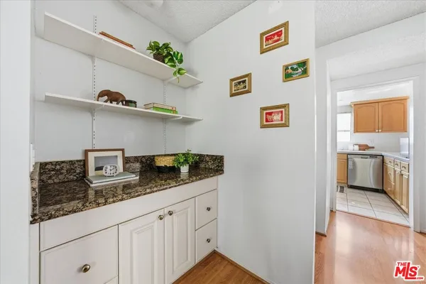 a kitchen with cabinets and window