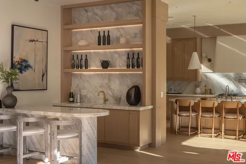 a room with a washing machine and cabinets