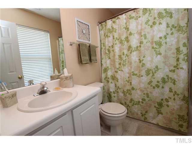 3812 Hopper Street Raleigh, NC 27616 - Photo 11 of 19 a bathroom with a sink toilet and shower
