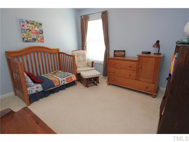 3812 Hopper Street Raleigh, NC 27616 - Photo 14 of 19 a bedroom with furniture and a window