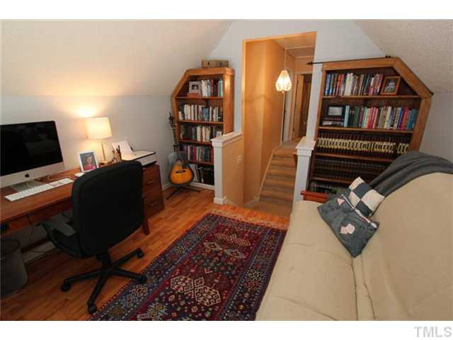 3812 Hopper Street Raleigh, NC 27616 - Photo 16 of 19 a view of a workspace with furniture and wooden floor